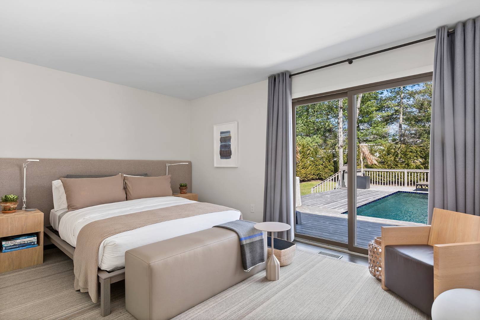 716 Hands Creek Road East Hampton, NY 11937 - Photo 13 of 24 a bedroom with a bed and a large window