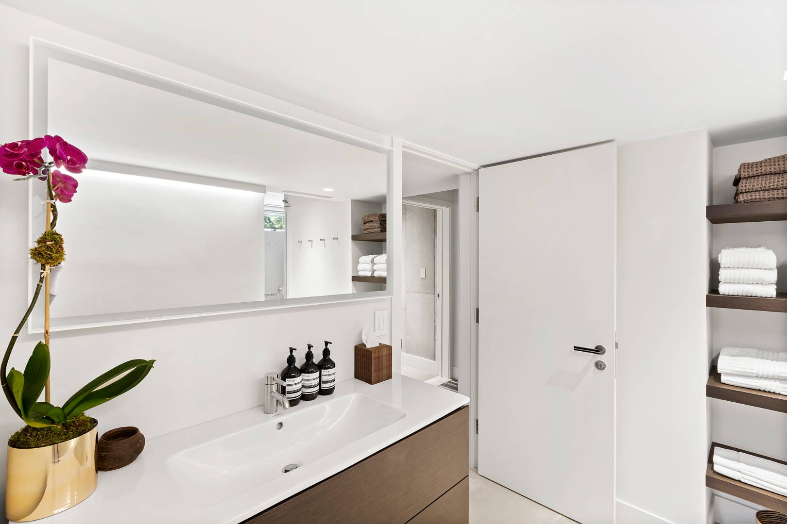 716 Hands Creek Road East Hampton, NY 11937 - Photo 16 of 24 a bathroom with a sink vanity tub and a mirror