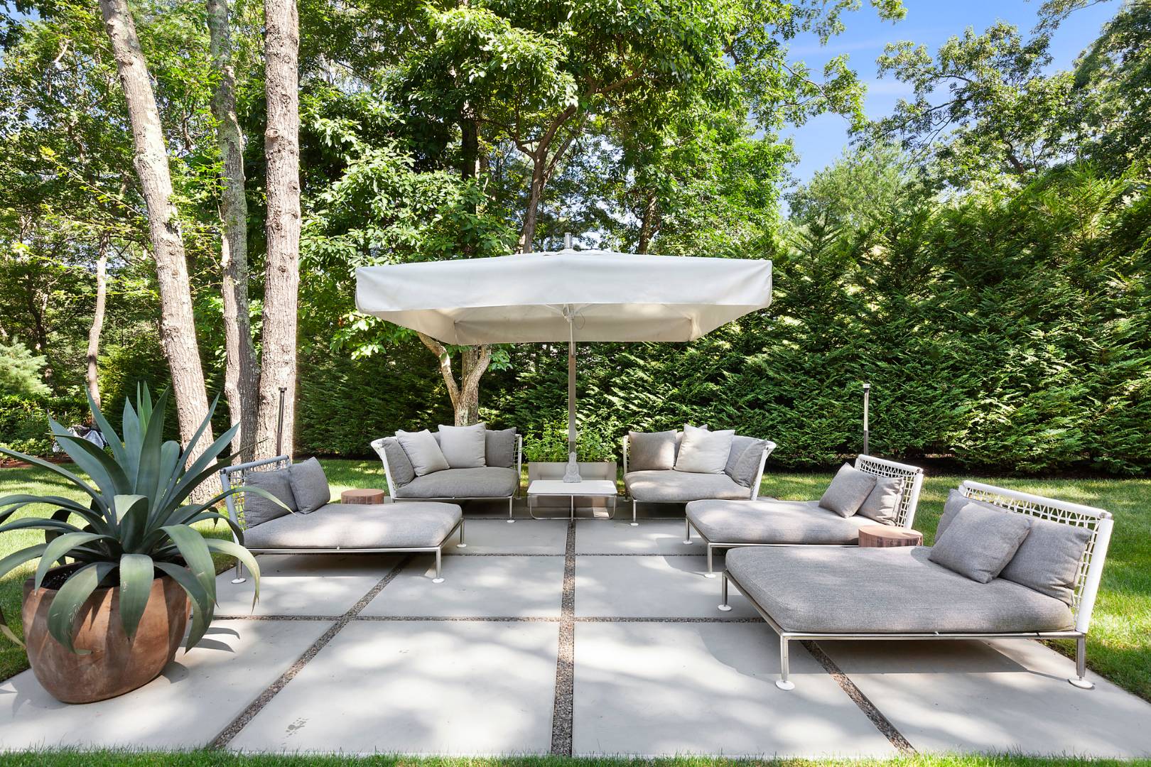 716 Hands Creek Road East Hampton, NY 11937 - Photo 21 of 24 a view of patio with couches and a fire pit