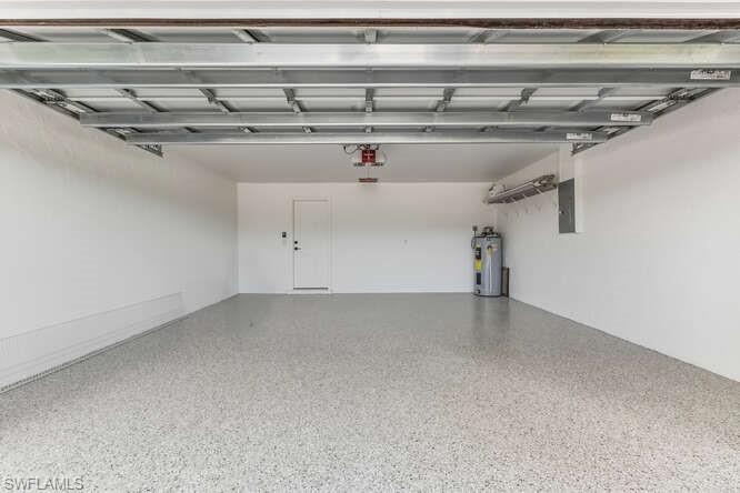 2876 West Crown Pointe Boulevard Naples, FL 34112 - Photo 23 of 36 Two Car Garage with hurricane rated garage door and new epoxy floor.