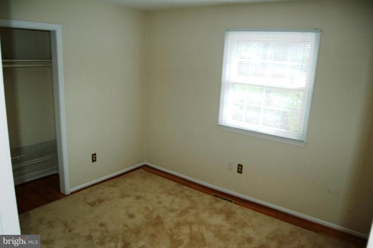 18809 Willow Grove Road Olney, MD 20832 - Photo 10 of 15 a view of a small space with window in an empty room