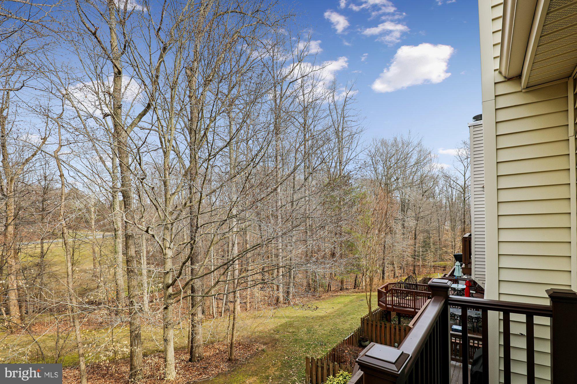 8019 Galla Knoll Circle Springfield, VA 22153 - Photo 24 of 57 a view of a balcony with chair and table