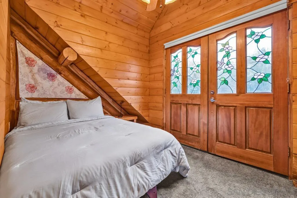 15469 Incapa Road Julian, CA 92036 - Photo 13 of 23 a bedroom with a bed and a window