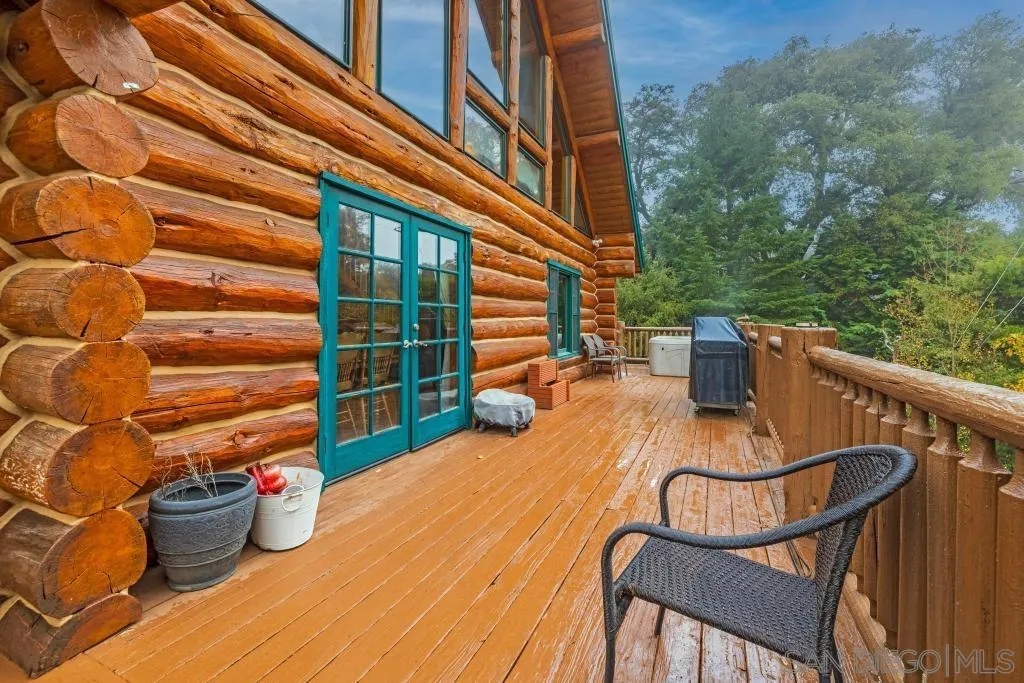 15469 Incapa Road Julian, CA 92036 - Photo 16 of 23 a view of a balcony with chair and wooden floor