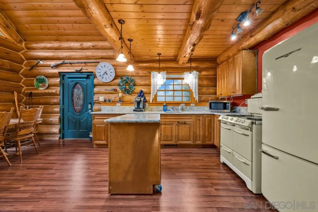 15469 Incapa Road Julian, CA 92036 - Photo 4 of 23 a kitchen with stainless steel appliances granite countertop a sink a stove and a refrigerator