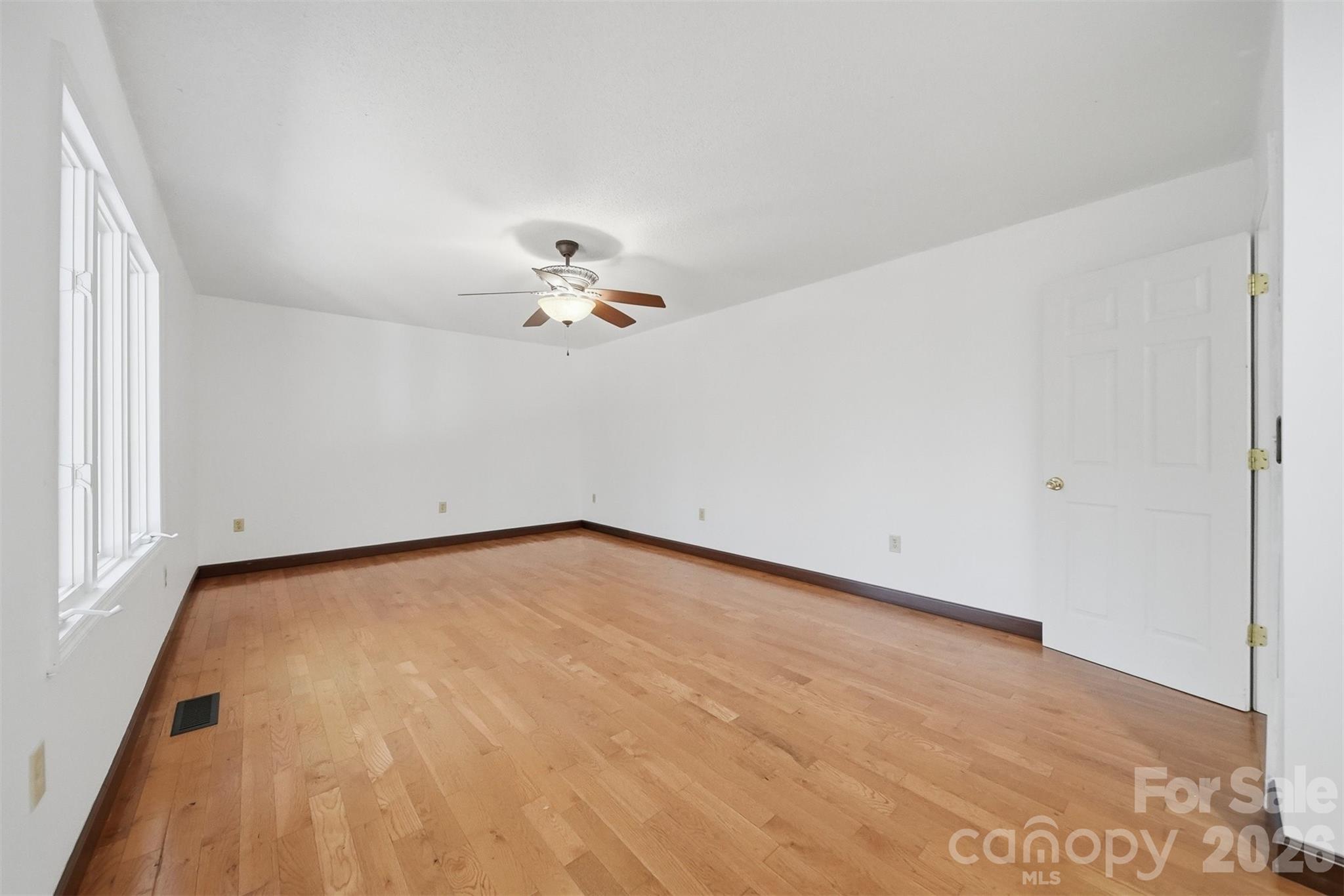 4771 Petra Mill Road Granite Falls, NC 28630 - Photo 24 of 46 a view of an empty room with a chandelier fan