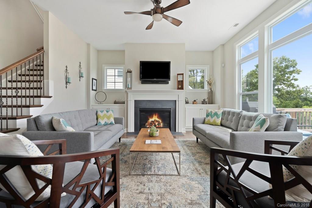 5354 Meadowcroft Way, Unit 56 Fort Mill, SC 29708 - Photo 6 of 36 a living room with furniture a flat screen tv and a fireplace