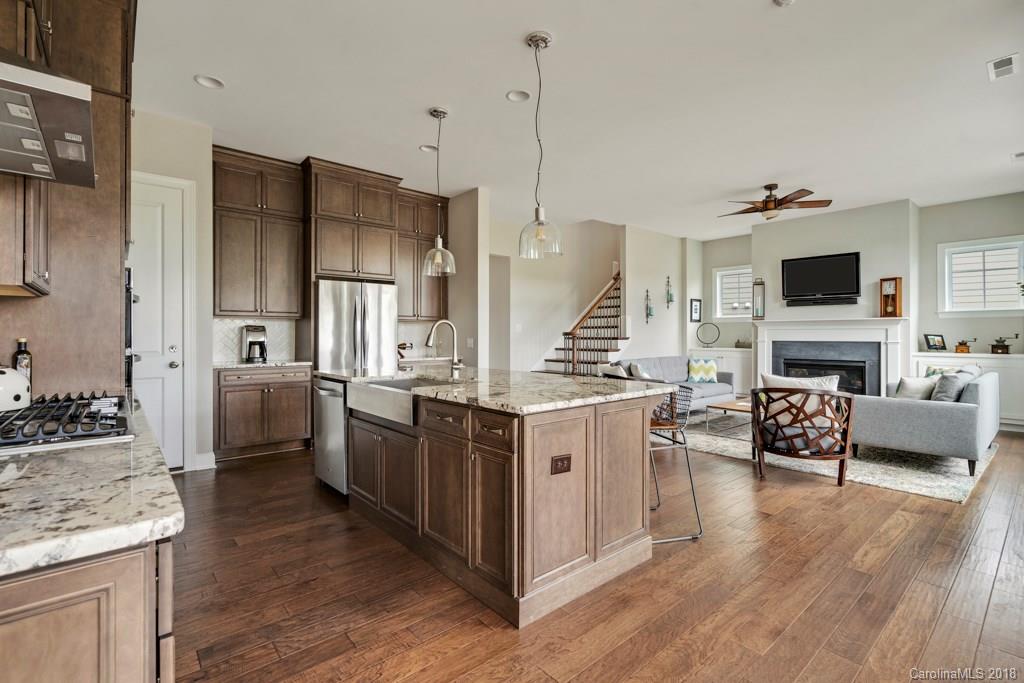 5354 Meadowcroft Way, Unit 56 Fort Mill, SC 29708 - Photo 9 of 36 a kitchen with stainless steel appliances granite countertop a sink stove and refrigerator