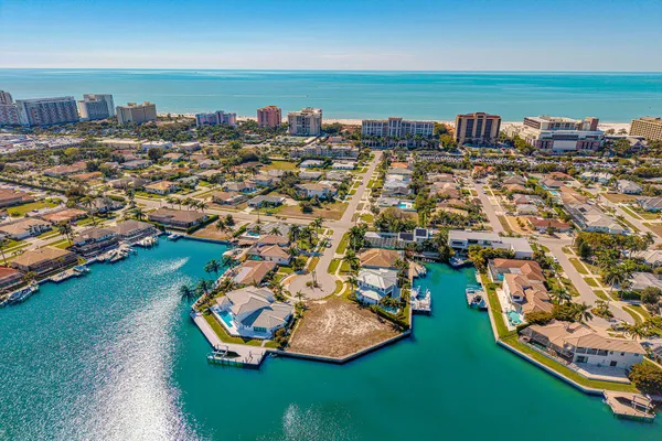 an aerial view of a house with a lake view