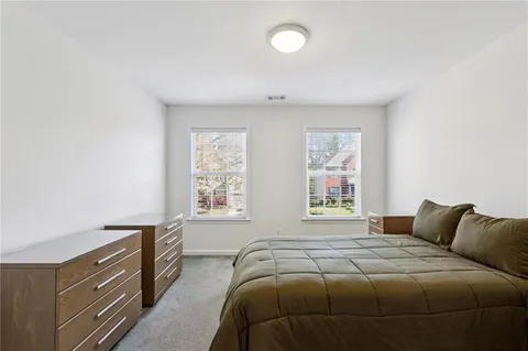 a bedroom with a bed and window