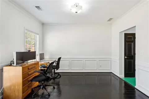 a view of workspace with wooden floor windows