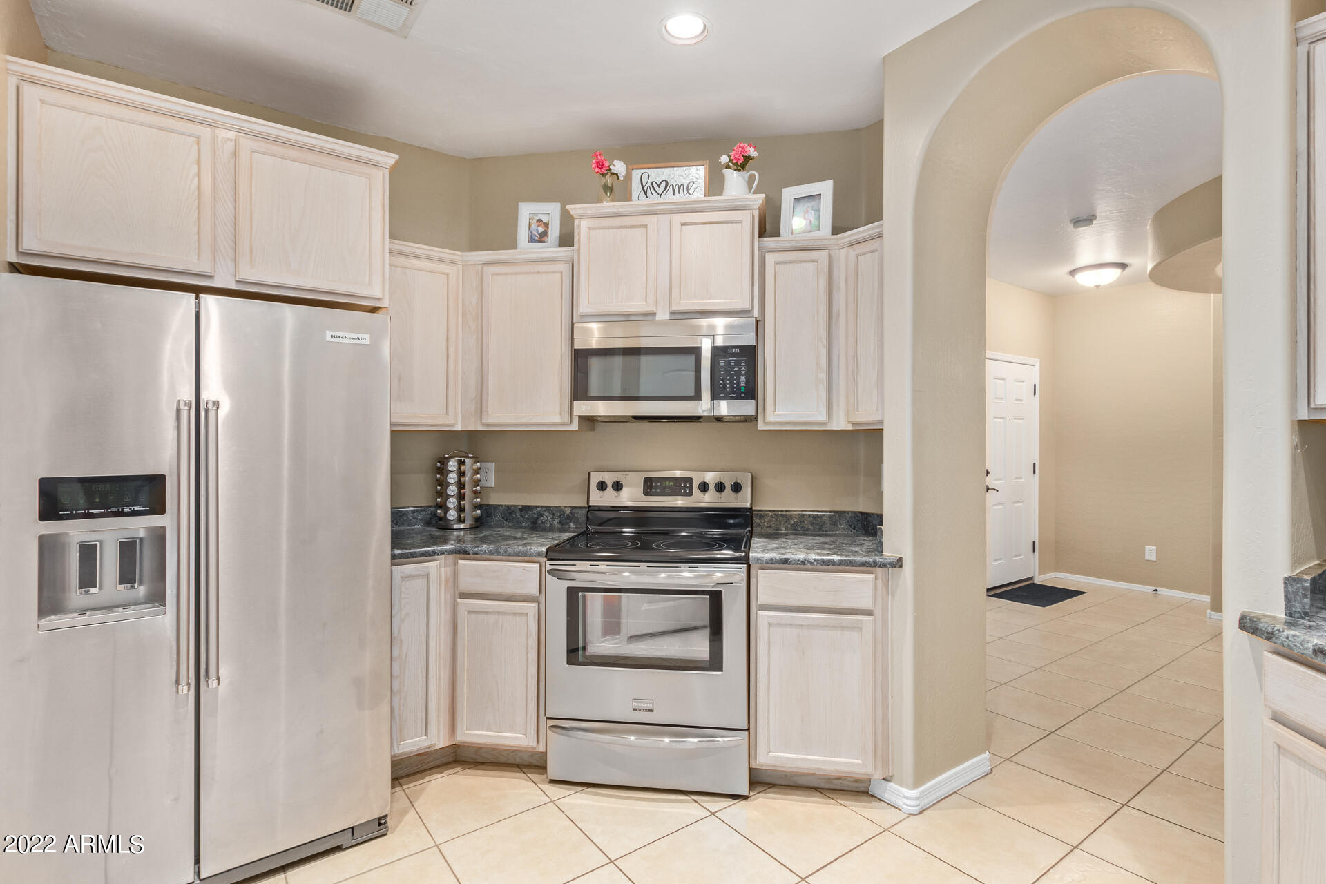 2565 South Signal Butte Road, Unit 47 Mesa, AZ 85209 - Photo 11 of 29 a kitchen with stainless steel appliances a refrigerator sink and microwave