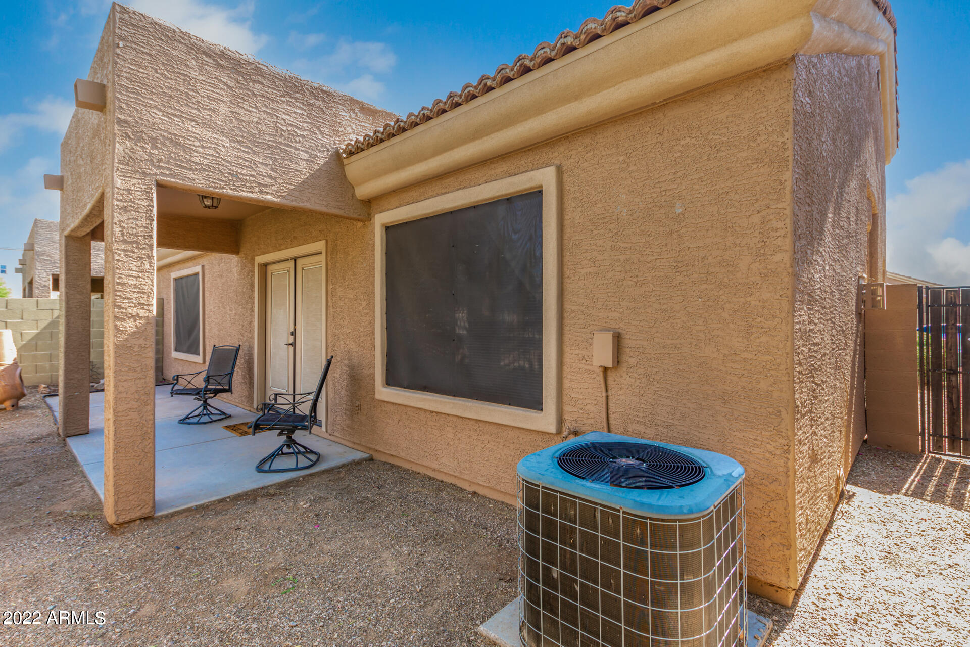 2565 South Signal Butte Road, Unit 47 Mesa, AZ 85209 - Photo 23 of 29 a view of a porch with a table and chairs