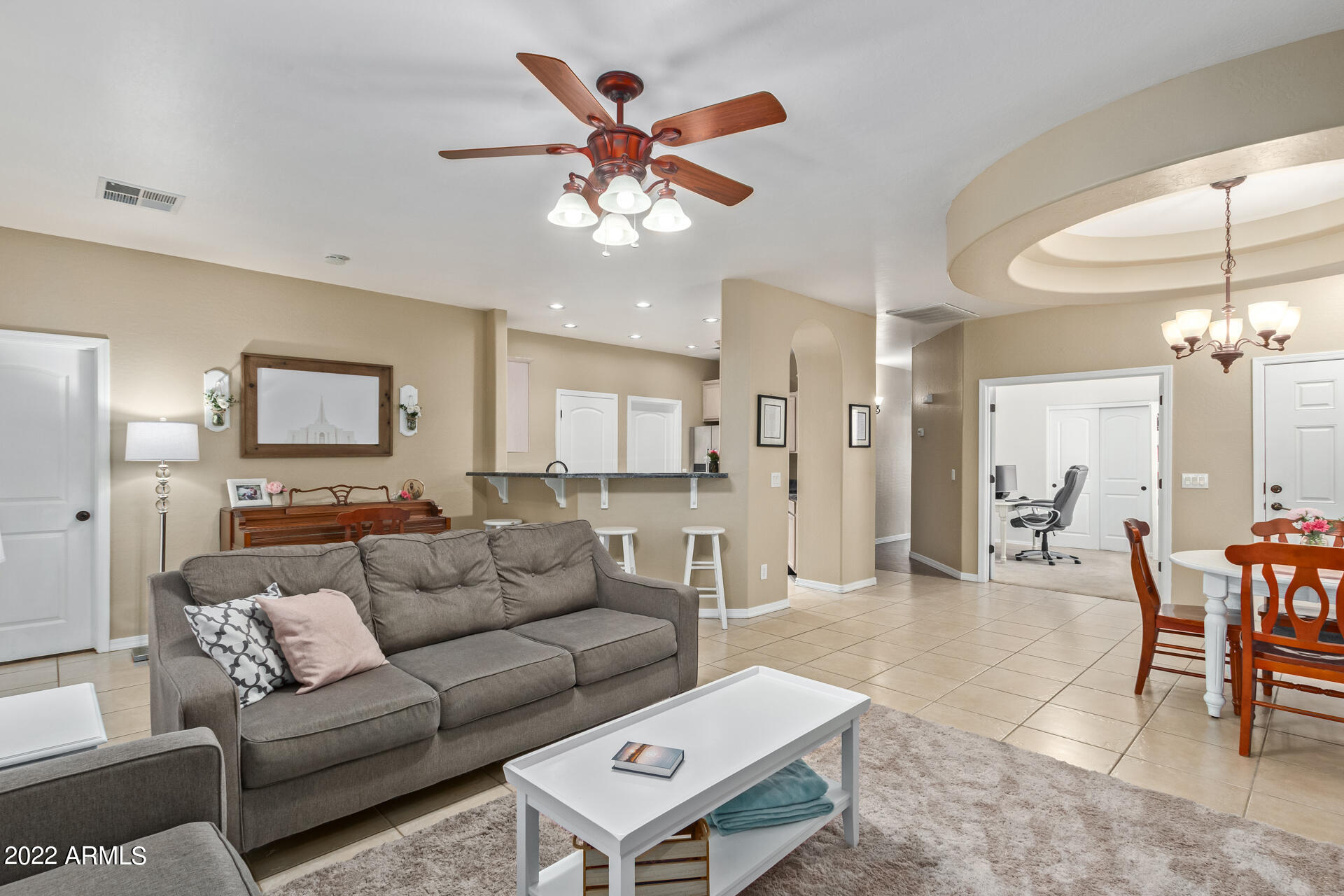 2565 South Signal Butte Road, Unit 47 Mesa, AZ 85209 - Photo 5 of 29 a living room with furniture and a chandelier