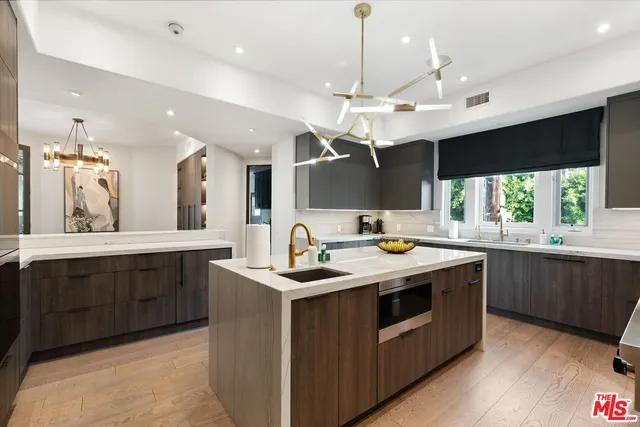 a kitchen with a stove and a sink