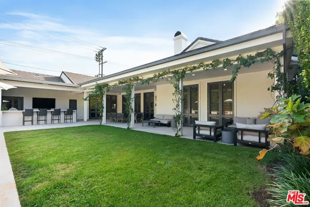 a front view of a house with garden and porch