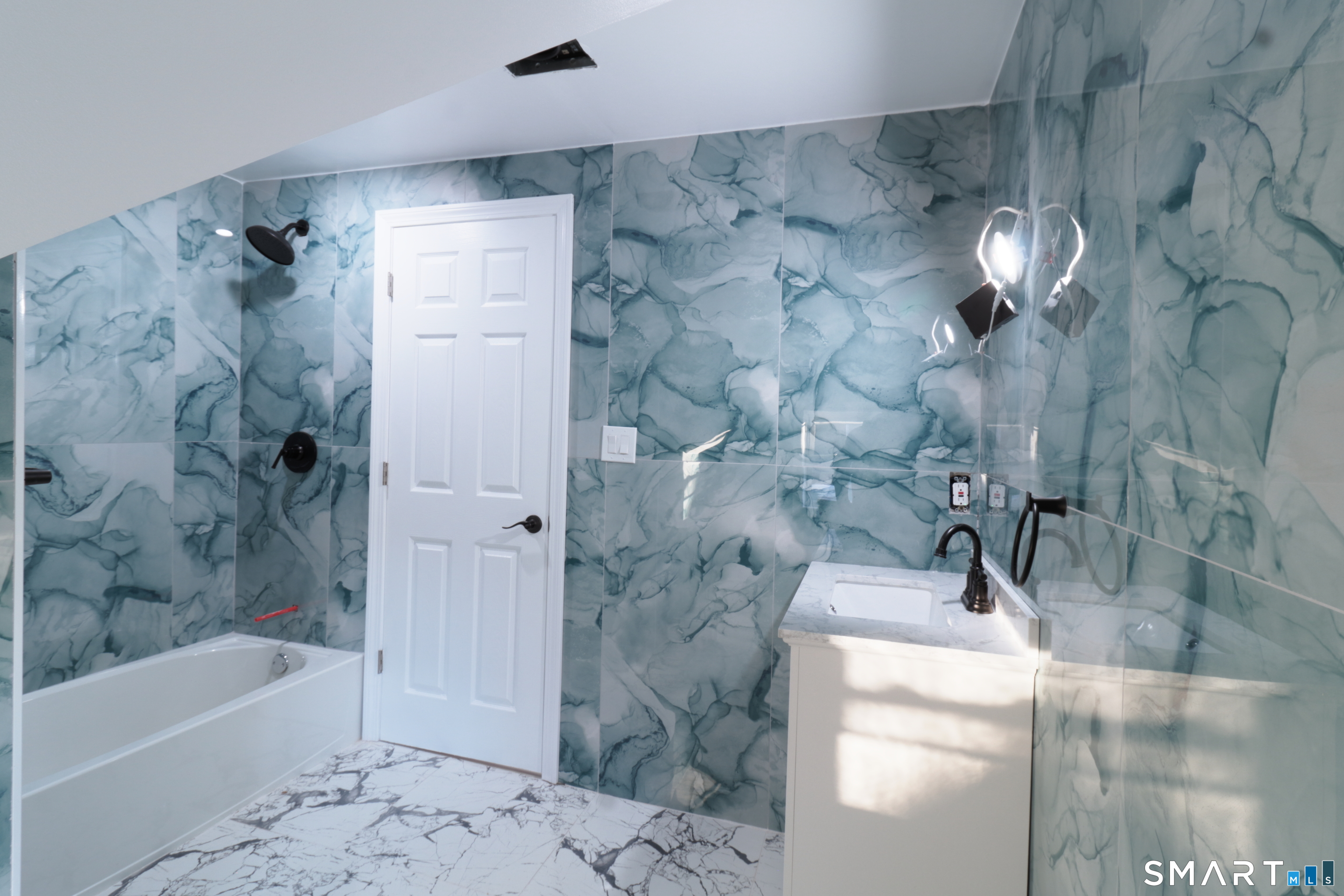 40 Elizabeth Street, Unit 3 Waterbury, CT 06704 - Photo 7 of 10 a bathroom with a bathtub and shower