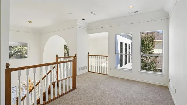 a view of a hallway with windows