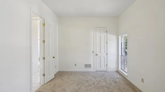 an empty room with windows