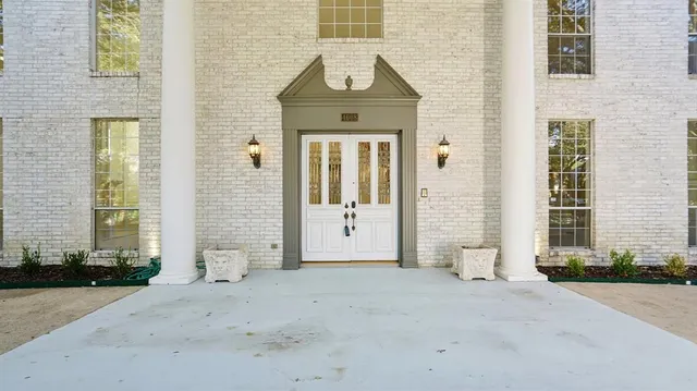an front view of a house with a yard