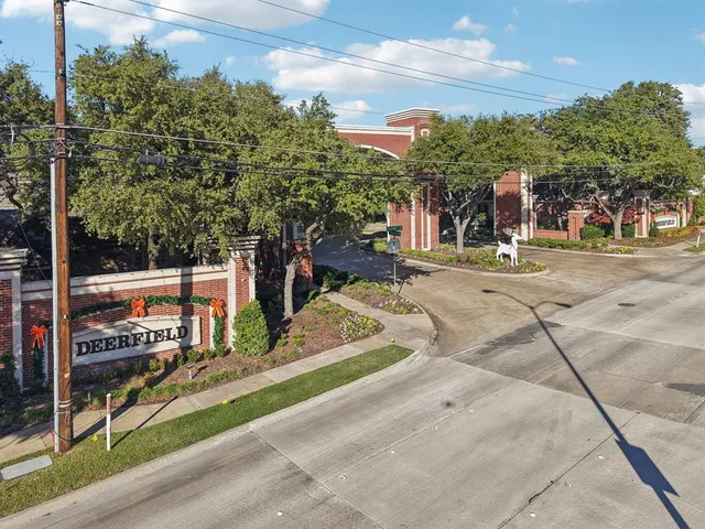 a view of a park with iron fence
