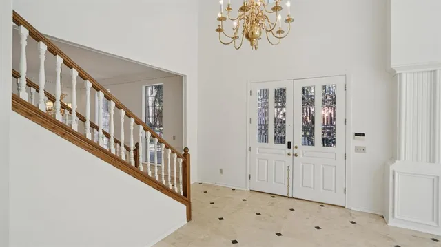 wooden floor with windows and stairs