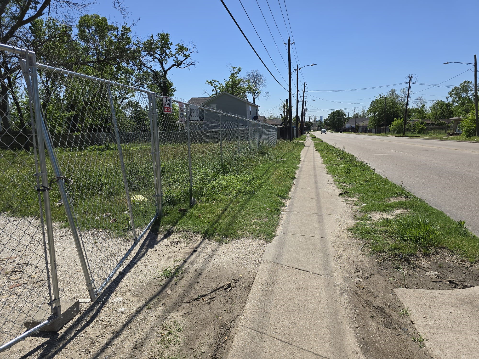 8506 North Main Street Houston, TX 77022 - Photo 5 of 12 a view of a street with a park on the side of it