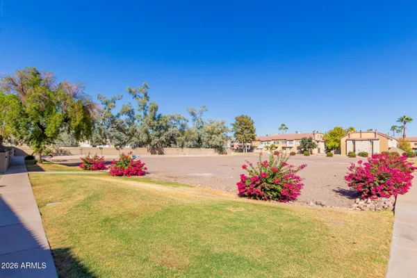 a house with palm tree in front of it