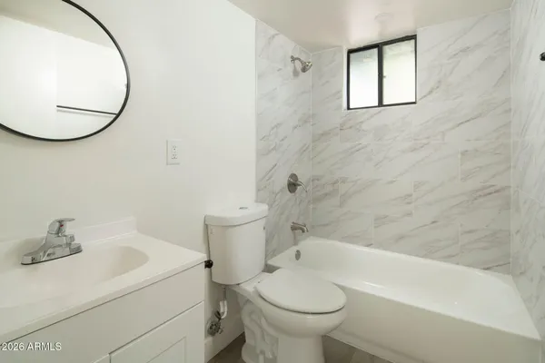 a bathroom with a sink toilet and a bathtub