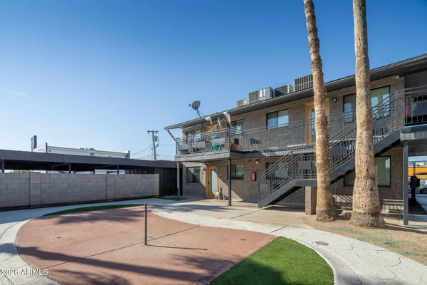 a view of a house with car parked