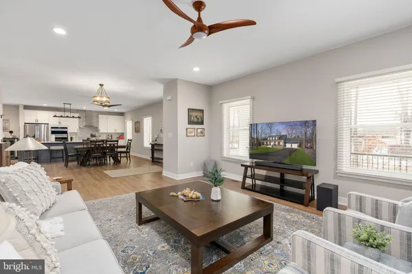 a kitchen with appliances a sink and cabinets