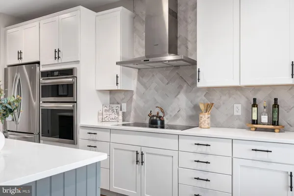 a kitchen with a sink and a large window