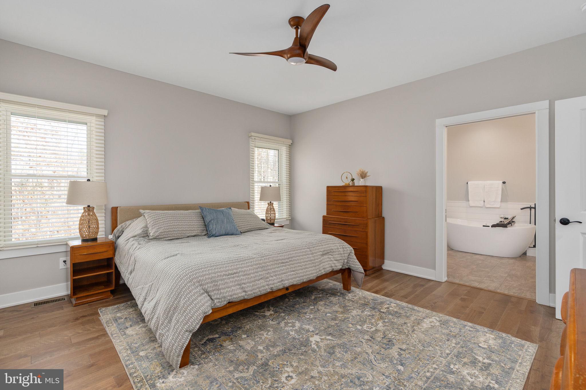 261 Washington Street Locust Grove, VA 22508 - Photo 26 of 90 a bedroom with a bed and wooden floor