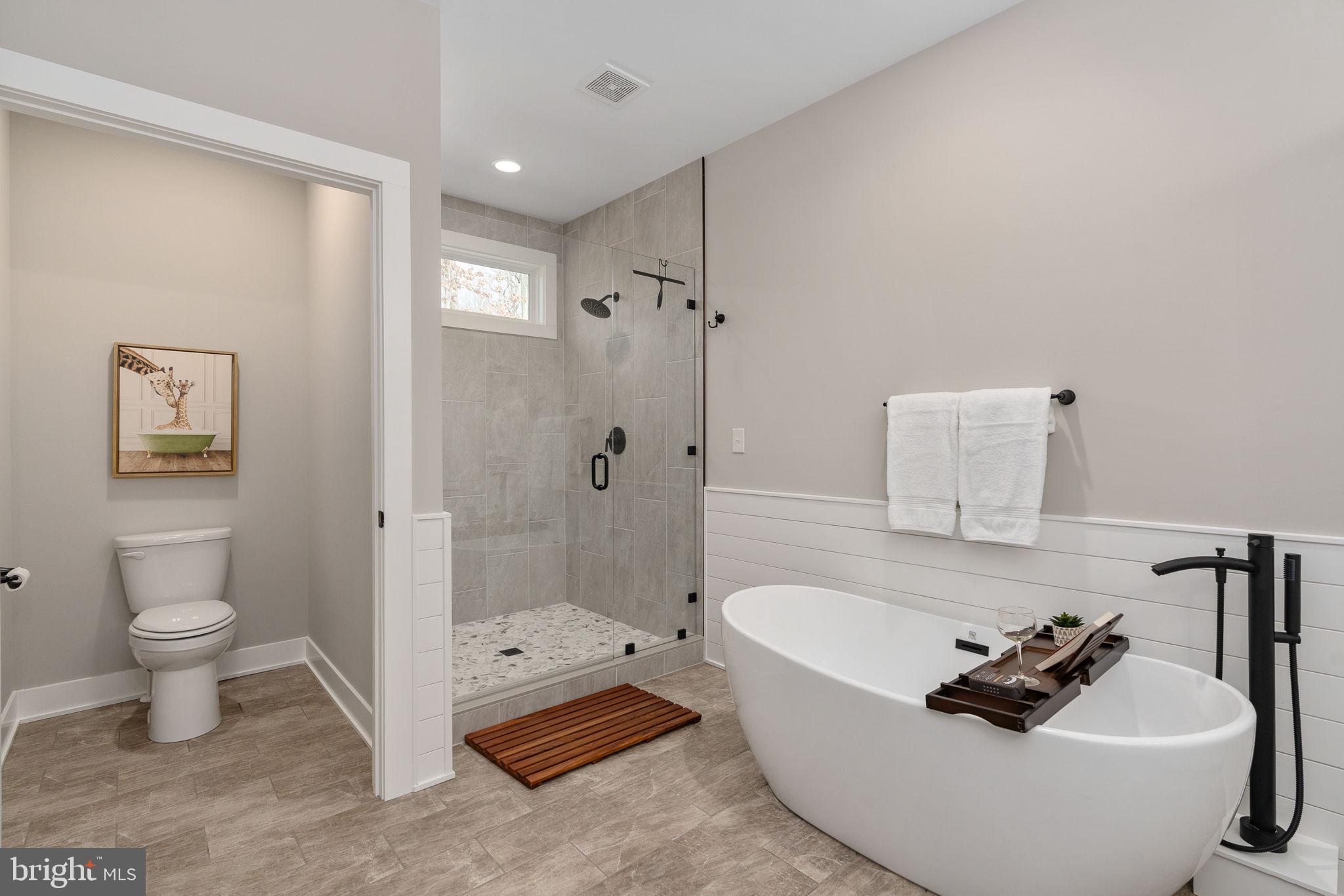 261 Washington Street Locust Grove, VA 22508 - Photo 27 of 69 a bathroom with a tub sink toilet and shower
