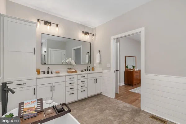 a utility room with sink dryer and washer