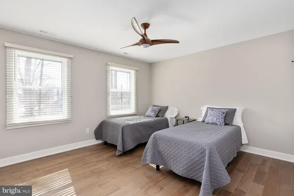 an aerial view of a house with a yard basket ball court and outdoor seating