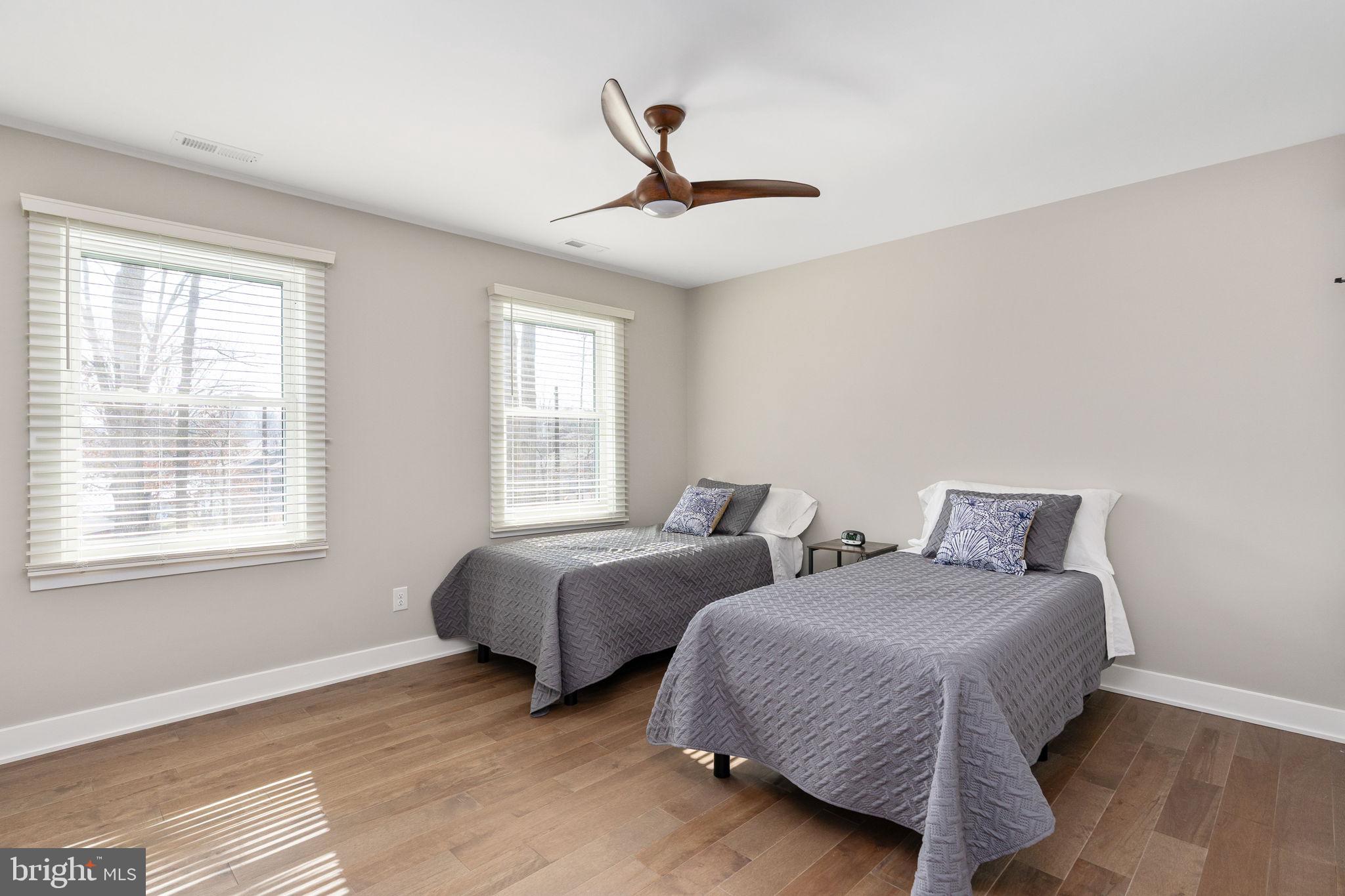 261 Washington Street Locust Grove, VA 22508 - Photo 44 of 90 a spacious bedroom with two beds and a window