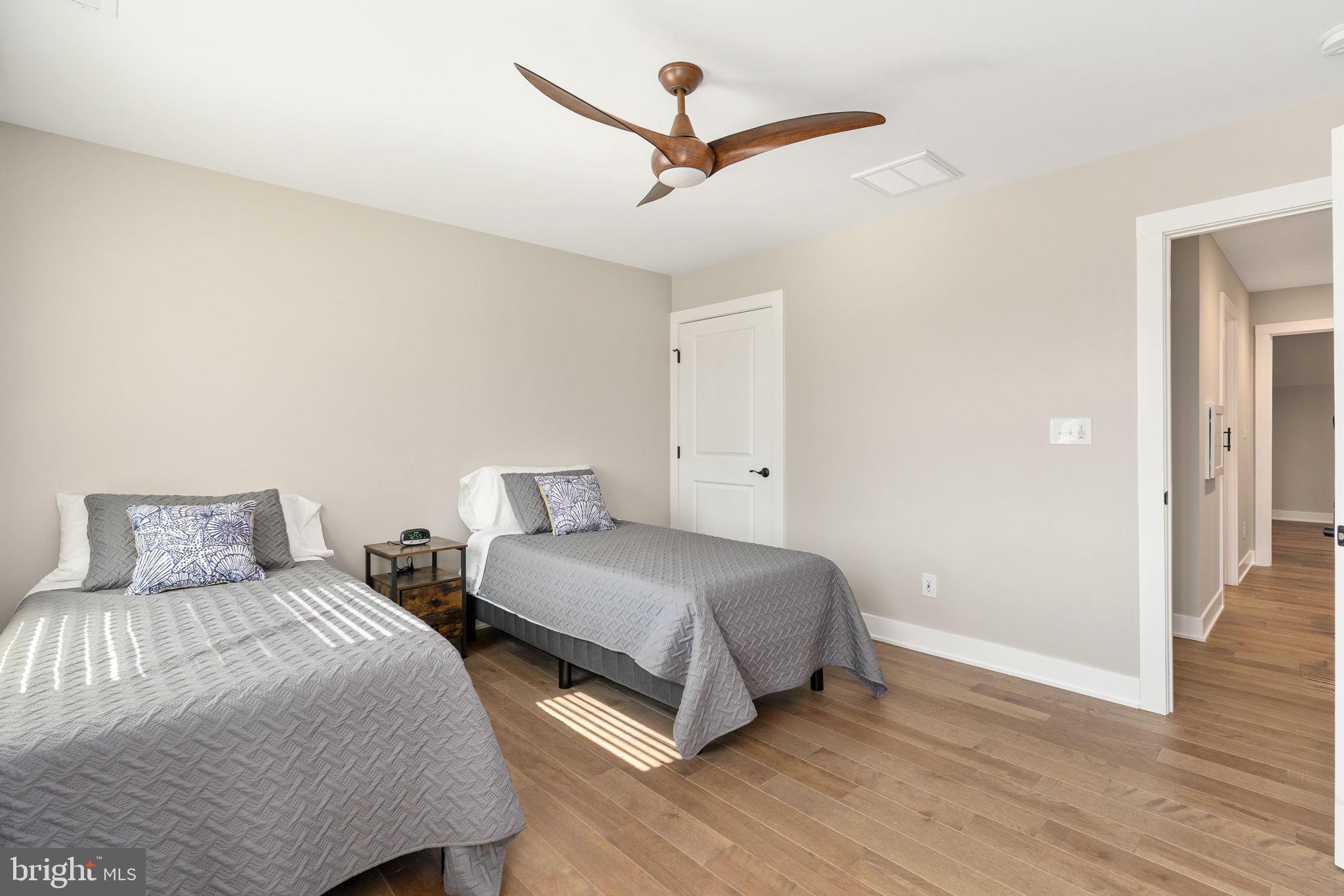 261 Washington Street Locust Grove, VA 22508 - Photo 44 of 69 a bedroom with two bed and a ceiling fan