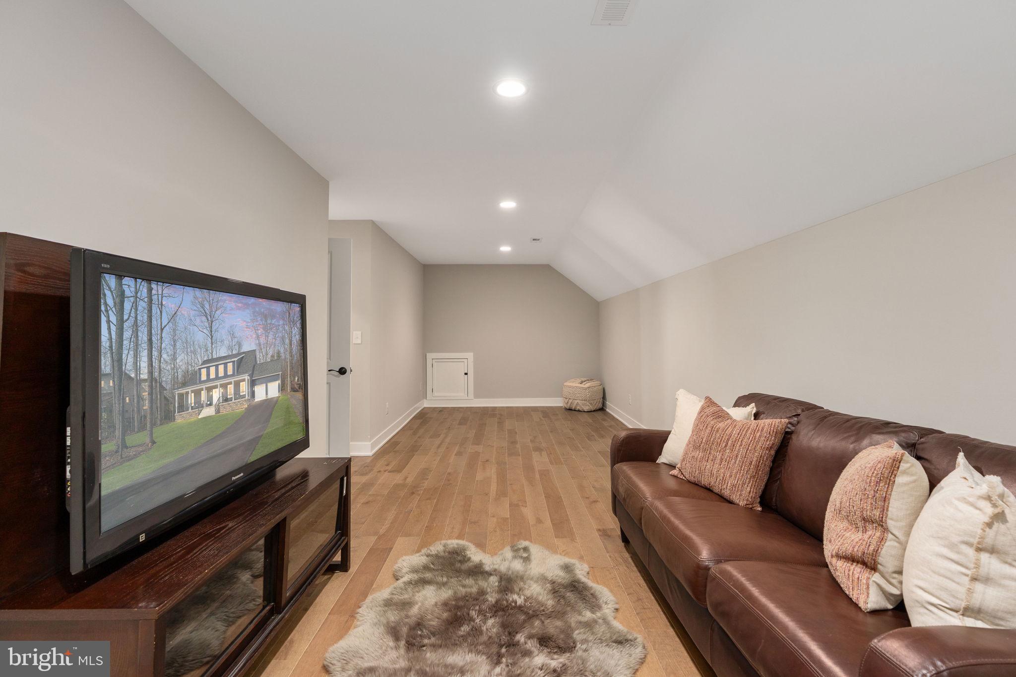 261 Washington Street Locust Grove, VA 22508 - Photo 48 of 69 a living room with furniture and a flat screen tv