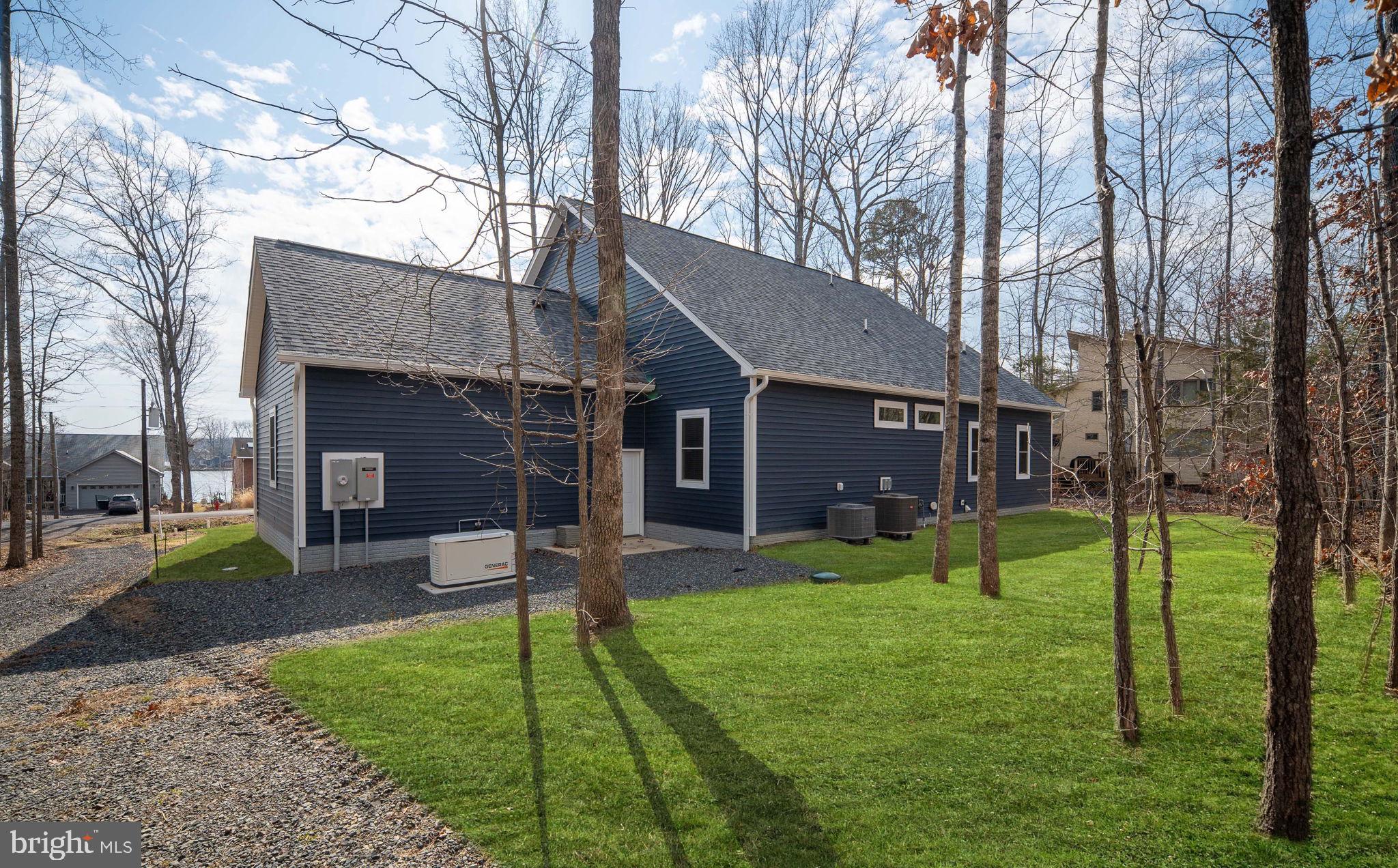 261 Washington Street Locust Grove, VA 22508 - Photo 55 of 90 a view of a house with a yard and a large tree