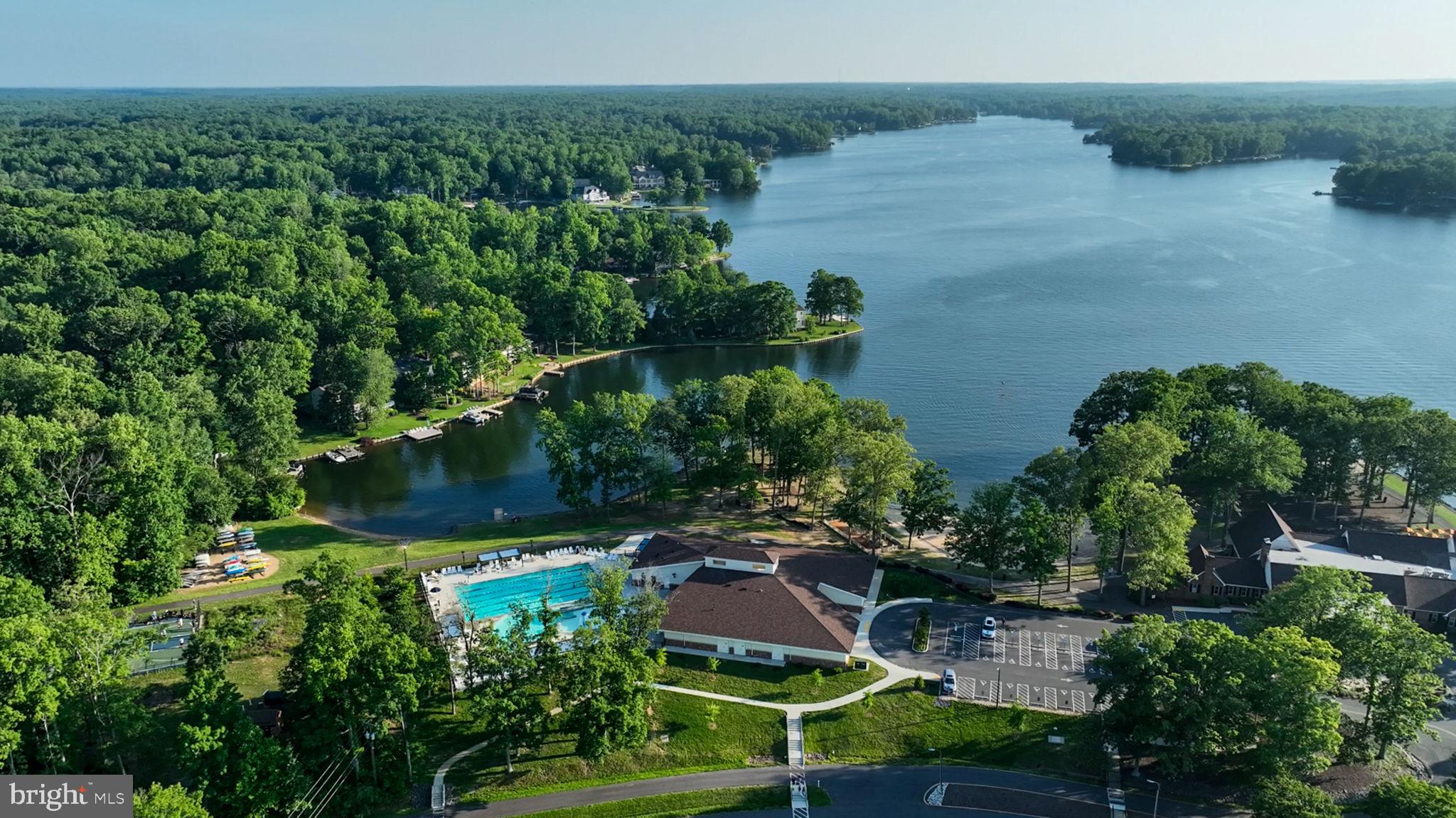 261 Washington Street Locust Grove, VA 22508 - Photo 60 of 90 an aerial view of a house with a yard and lake view