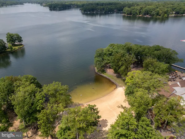 front view of a brick house with a yard