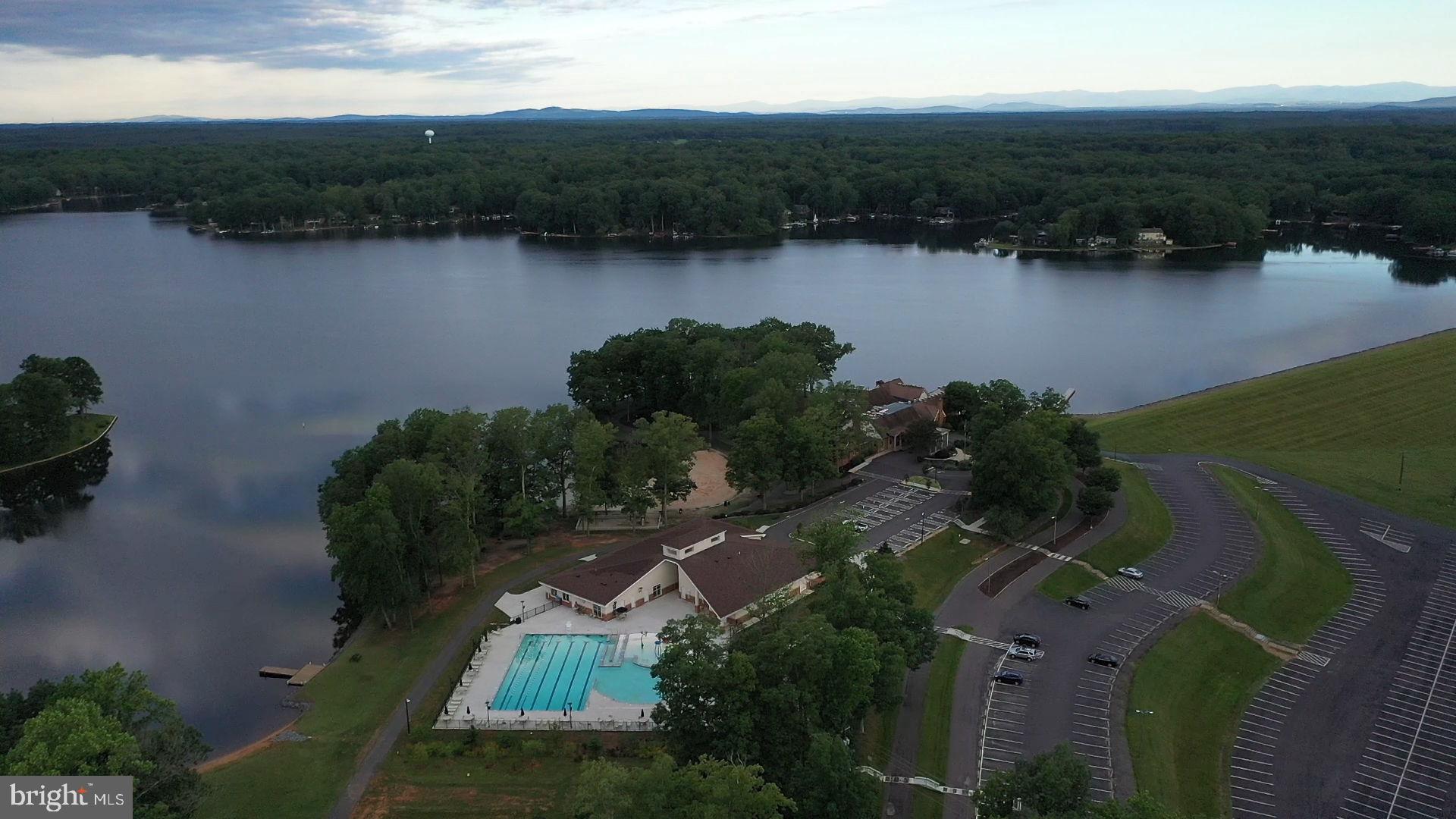 261 Washington Street Locust Grove, VA 22508 - Photo 64 of 90 an aerial view of lake residential house with outdoor space and trees around