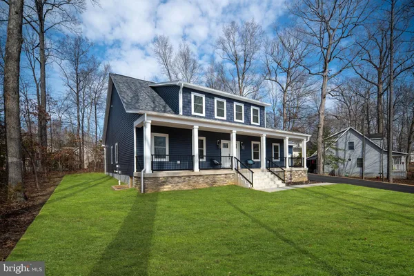 a view of a livingroom with furniture and a window
