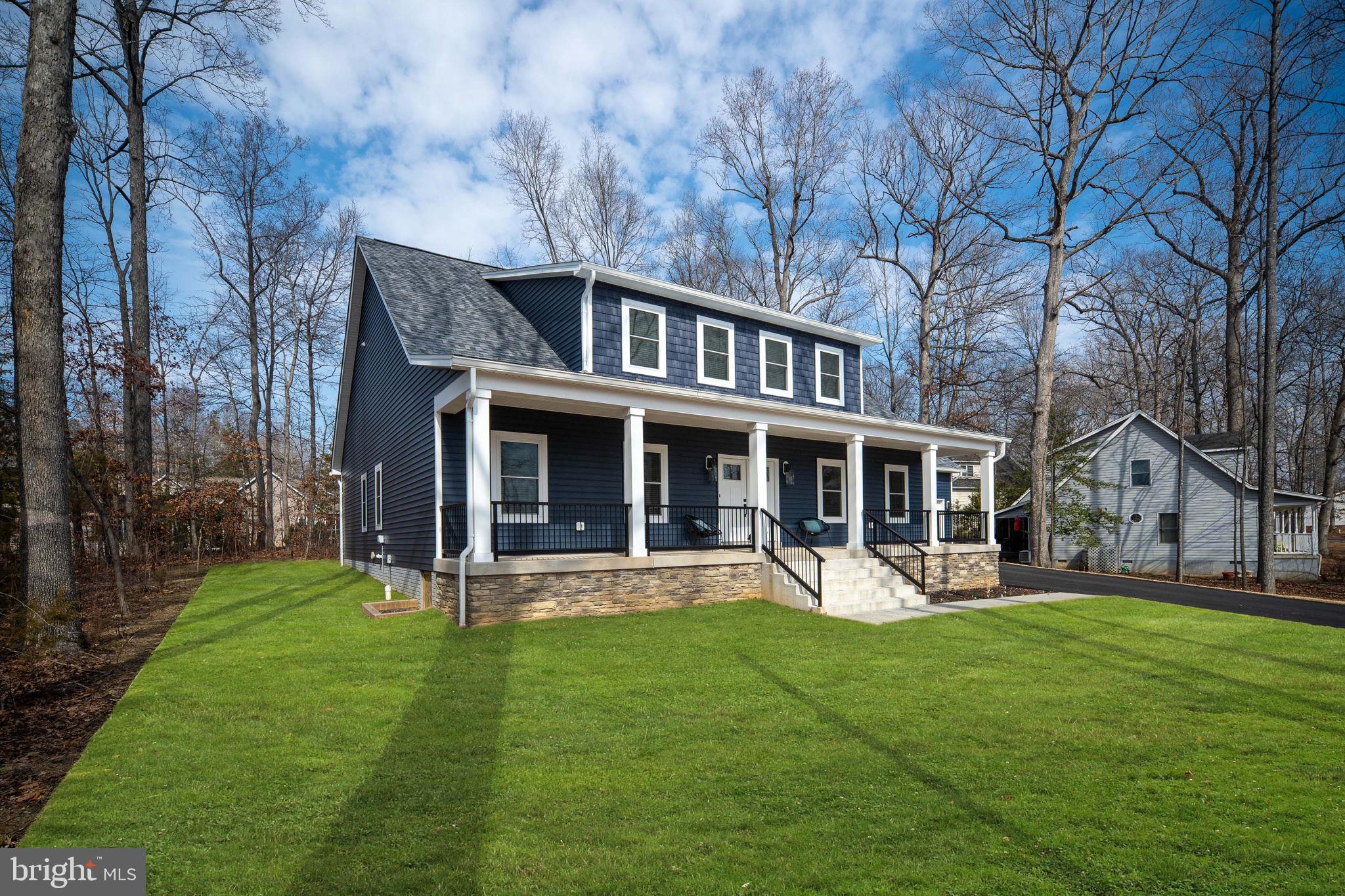 261 Washington Street Locust Grove, VA 22508 - Photo 7 of 69 a front view of a house with garden