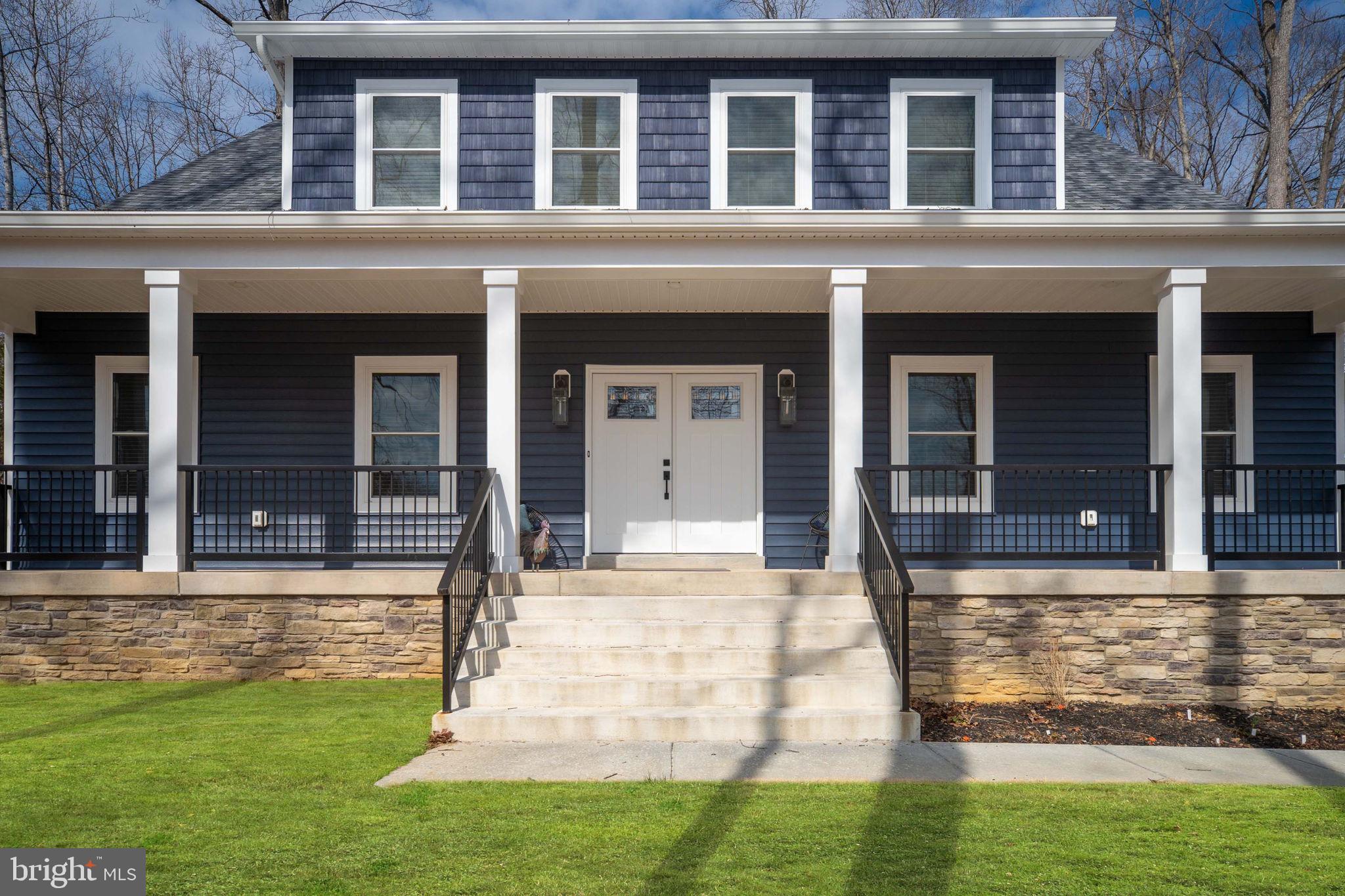 261 Washington Street Locust Grove, VA 22508 - Photo 8 of 69 front view of a brick house with a yard