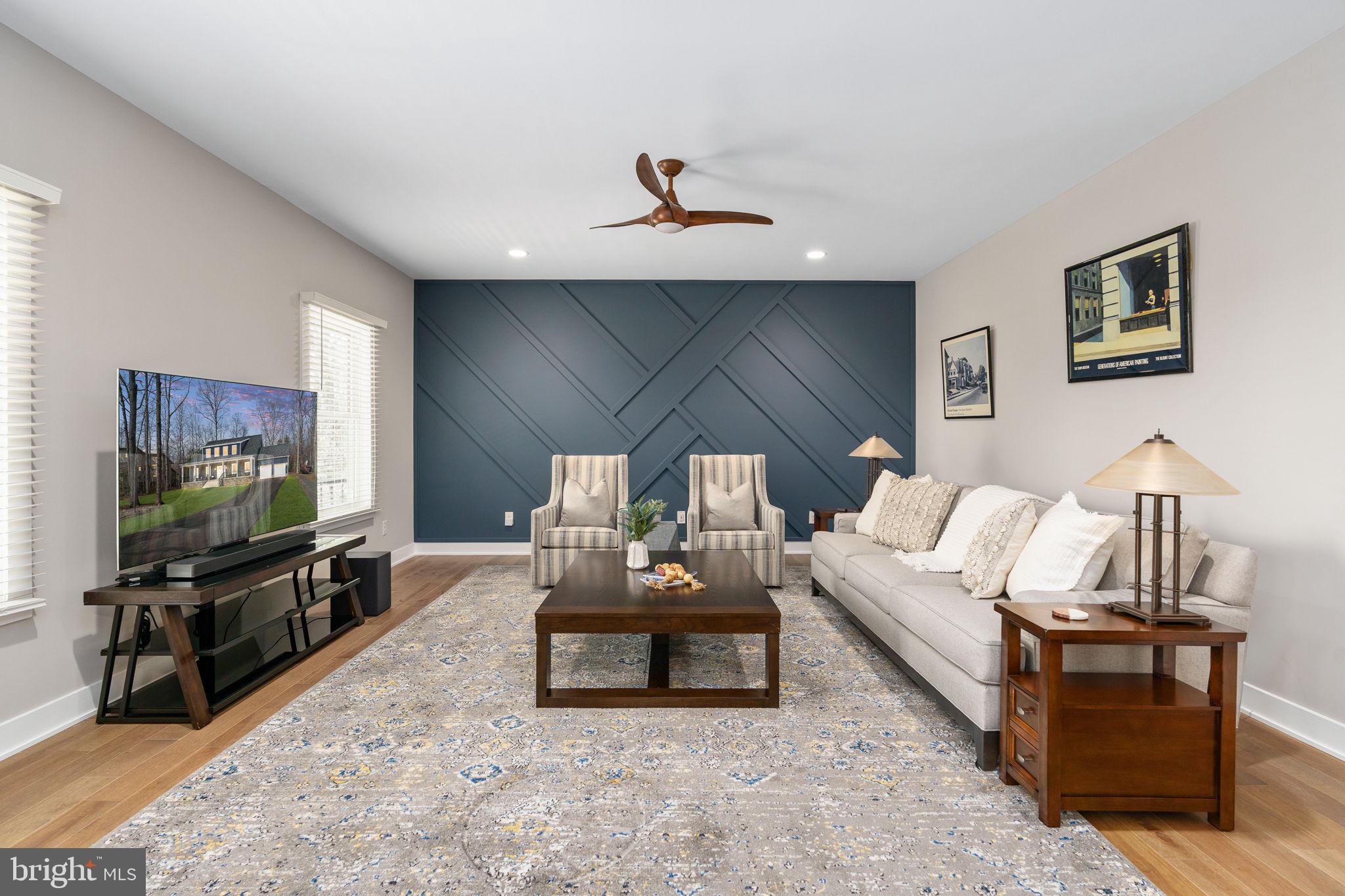 261 Washington Street Locust Grove, VA 22508 - Photo 10 of 69 a living room with furniture and a flat screen tv