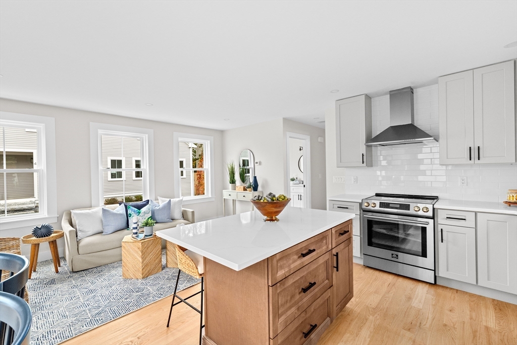 19 Ford Place, Unit 1 Scituate, MA 02066 - Photo 11 of 35 a view of kitchen with sink stove and refrigerator