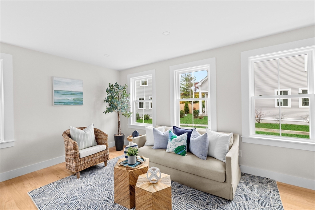 19 Ford Place, Unit 1 Scituate, MA 02066 - Photo 15 of 35 a living room with furniture and a large window