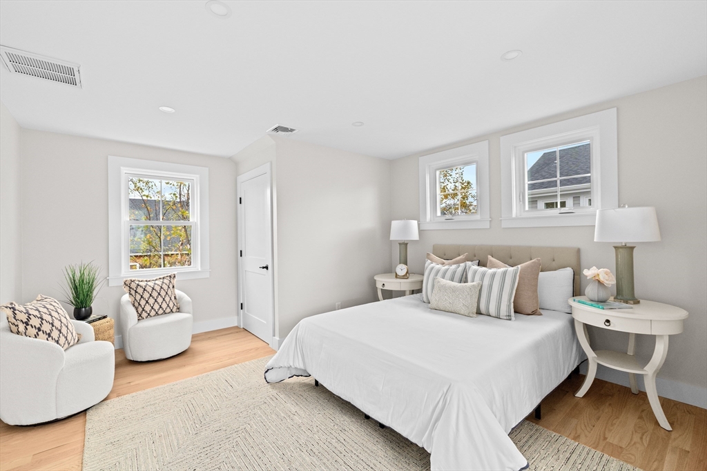 19 Ford Place, Unit 1 Scituate, MA 02066 - Photo 22 of 35 a bedroom with a bed and a couch